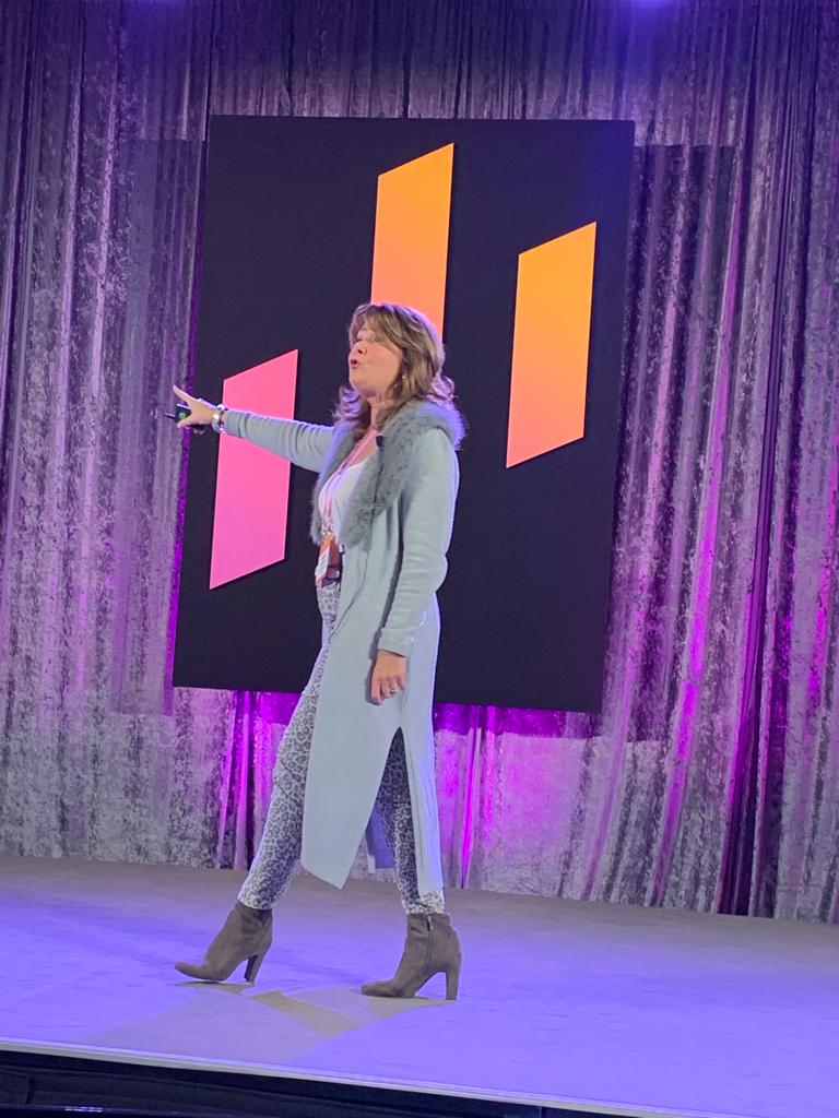 Mary Greanias facilitating a session on stage