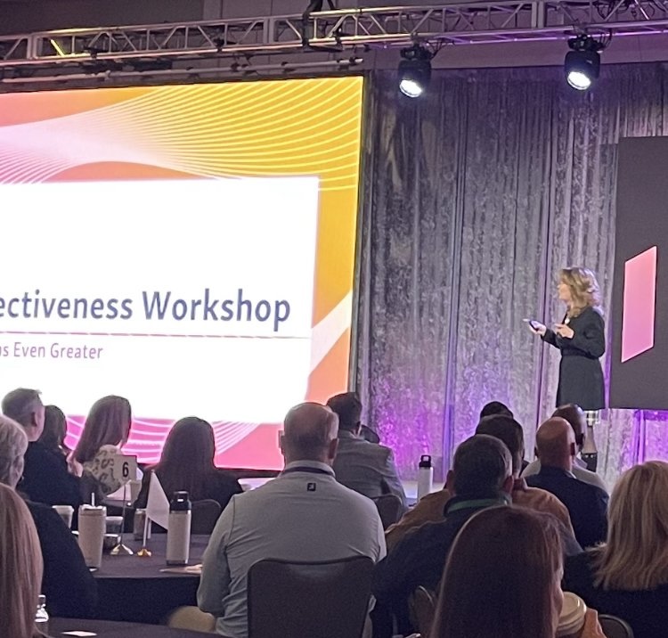 Mary Greanias facilitating a leadership workshop on stage